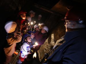 Children in the Killhope mine with a guide